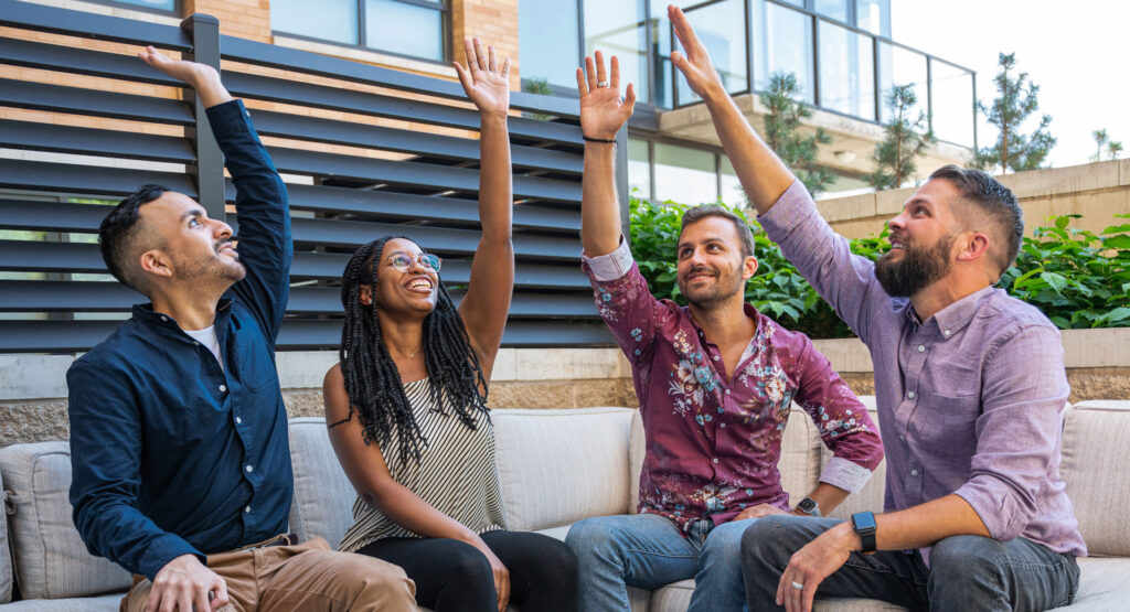 Picture of Solid Digital's team hi-fiving each other